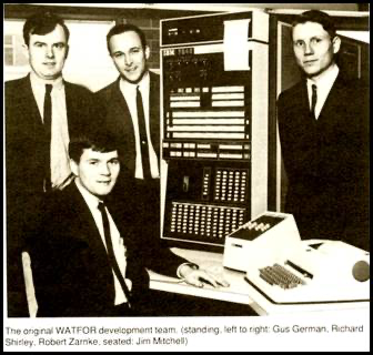 A group of men in suits standing in front of a computer AI-generated content may be incorrect.